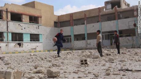 Najem plays soccer with his friends. 