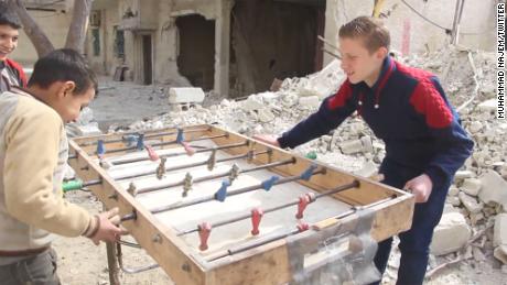 Najem and his friends find a spot of childhood happiness, playing foosball in their bombed out streets. 