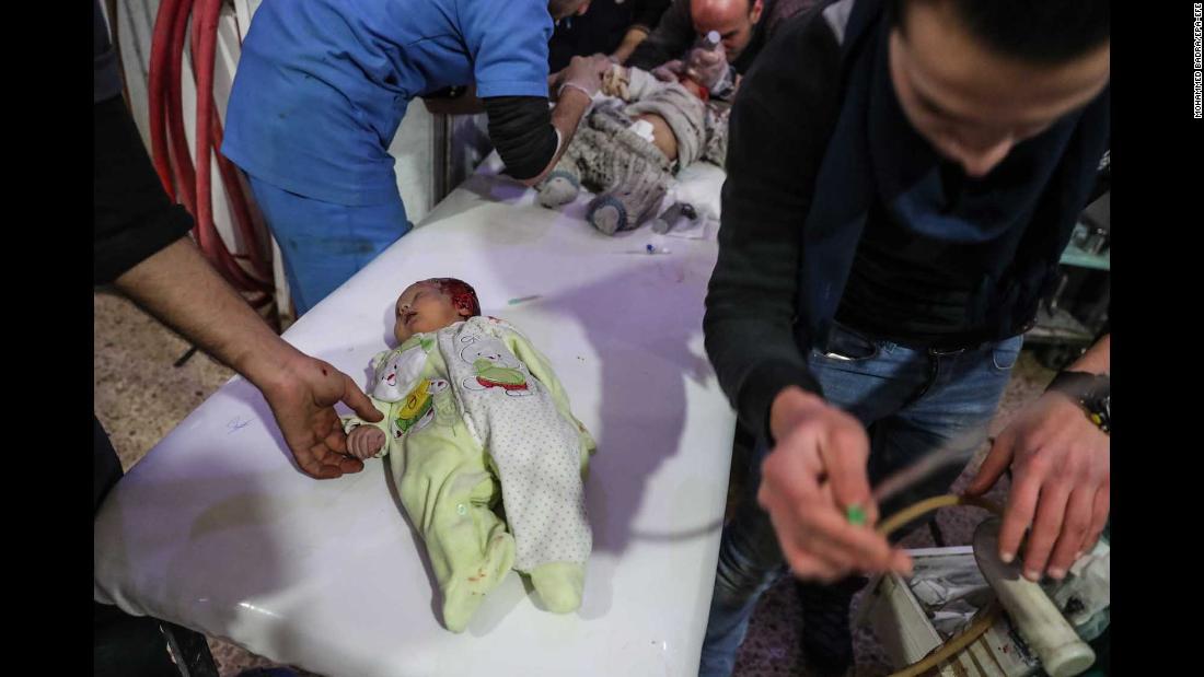 Injured children are treated at a hospital in Douma.