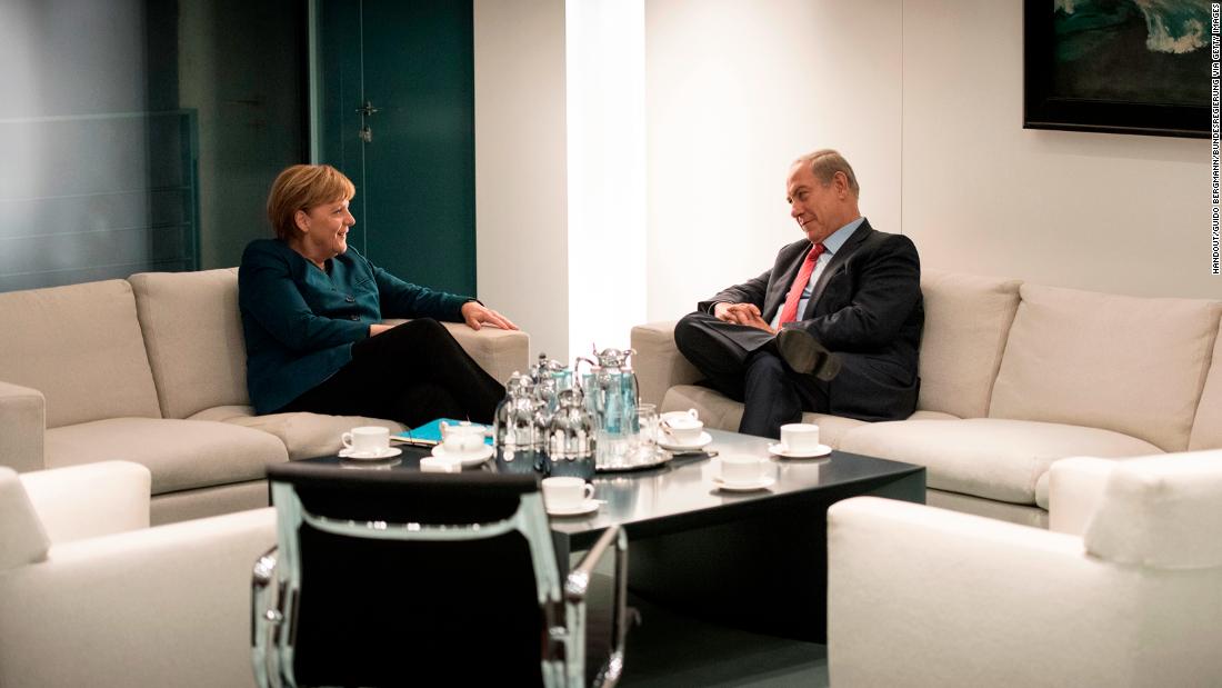 Netanyahu and German Chancellor Angela Merkel talk in Berlin in October 2015.