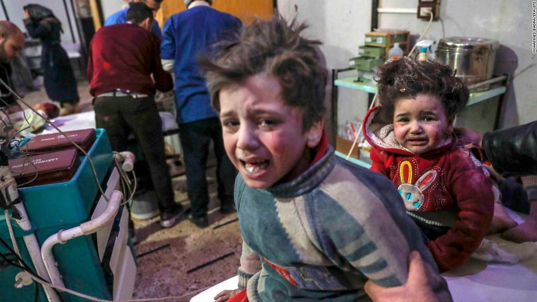 Injured children are treated at a hospital in Douma.