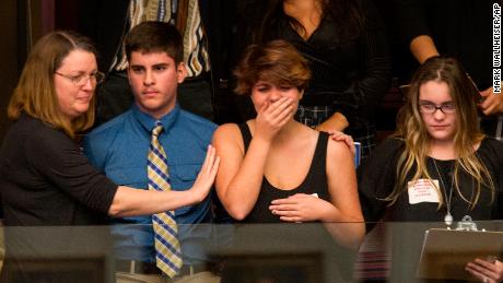 Sheryl Acquaroli, a 16-year-old junior from Marjory Stoneman Douglas High School, is overcome with emotion in the gallery of the House of Representatives after the vote. 