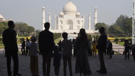 The Trudeau family stands silhouetted in front of the Taj Mahal in Agra on February 18.  