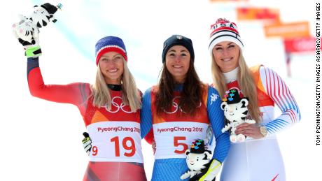 Sofia Goggia (center) celebrates with Ragnhild Mowinckel (left) and Lindsey Vonn (right).