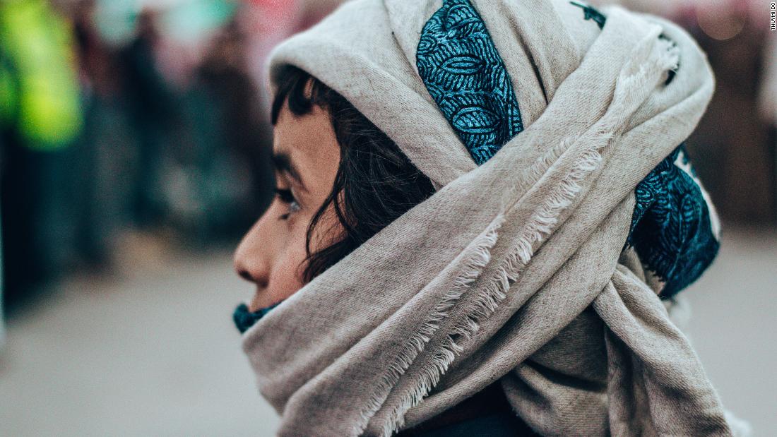 &lt;strong&gt;Family-friendly occasion: &lt;/strong&gt;A young boy watches the proceedings at the camel festival while wearing a scarf to keep dust off his face.&lt;br /&gt;