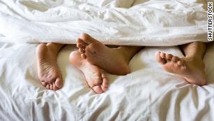 Get better sleep by cuddling up with your partner