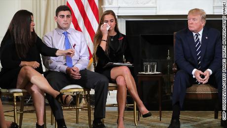 WASHINGTON, DC - FEBRUARY 21:  (AFP OUT) U.S. President Donald Trump (R)  hosts a listening session with Marjory Stoneman Douglas High School shooting survivors Julie Cordover (2nd R) and  Jonathan Blank and his mother Melissa Blank and others in the State Dining Room at the White House February 21, 2018 in Washington, DC. Trump is hosted the session in the wake of last week&#39;s mass shooting at the high school in Parkland, Florida, that left 17 students and teachers dead.  (Photo by Chip Somodevilla/Getty Images)