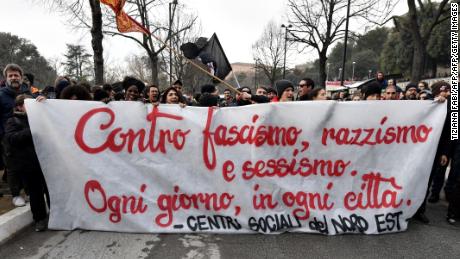 Italian demonstrators hold a banner reading &quot;against fascism, racism and sexism.&quot; Right wing, anti immigrant parties recently took power in Italy.