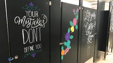 Parents paint messages of joy and kindness on school 
