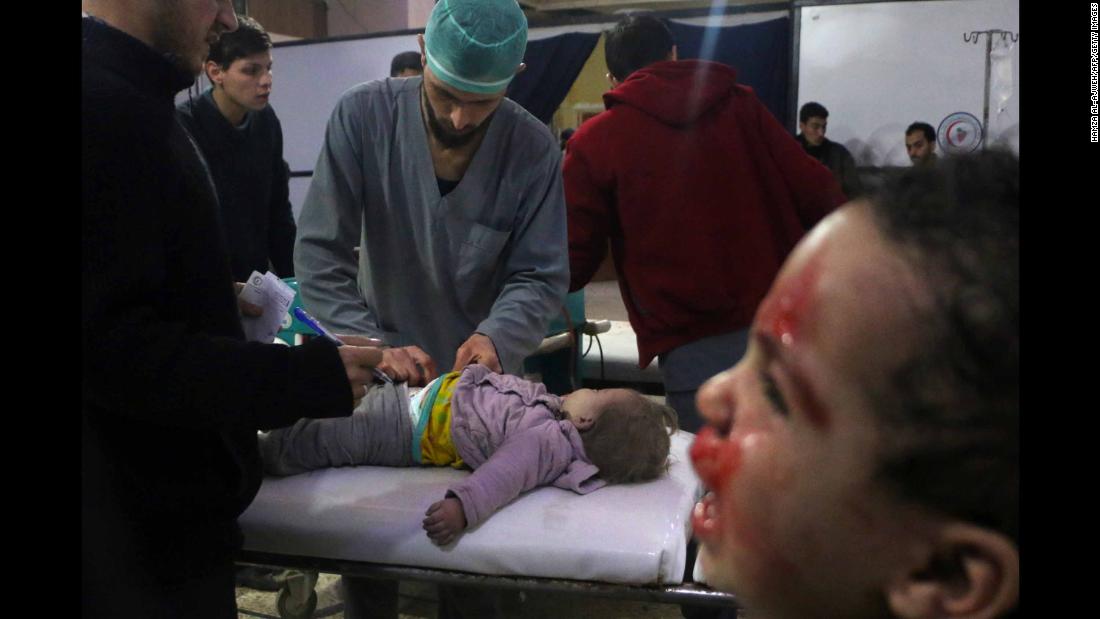 Medics tend to a baby as a child cries next to them at a makeshift clinic in Douma, Syria, on Thursday, February 23. &lt;a href=&quot;https://www.cnn.com/2018/02/23/middleeast/syria-eastern-ghouta-bombardment-fire-rockets-intl/index.html&quot; target=&quot;_blank&quot;&gt;More than 400 civilians have been killed&lt;/a&gt; this week in Syria&#39;s rebel-held Eastern Ghouta region, according to the head of the region&#39;s health department on Friday, February 23. Syrian regime forces have been pounding Eastern Ghouta with shells, mortars and bombs. 