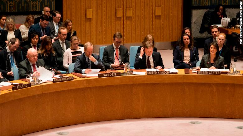 US Ambassador to the UN Nikki Haley speaks as Russia's Ambassador to the UN Vasily Nebenzia listens after a Security Council vote during a UN Security Council meeting on a ceasefire in Syria February 24, 2018 in New York. 