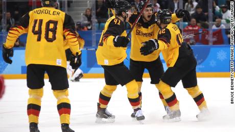 The German ice hockey team in action during the gold medal match.  