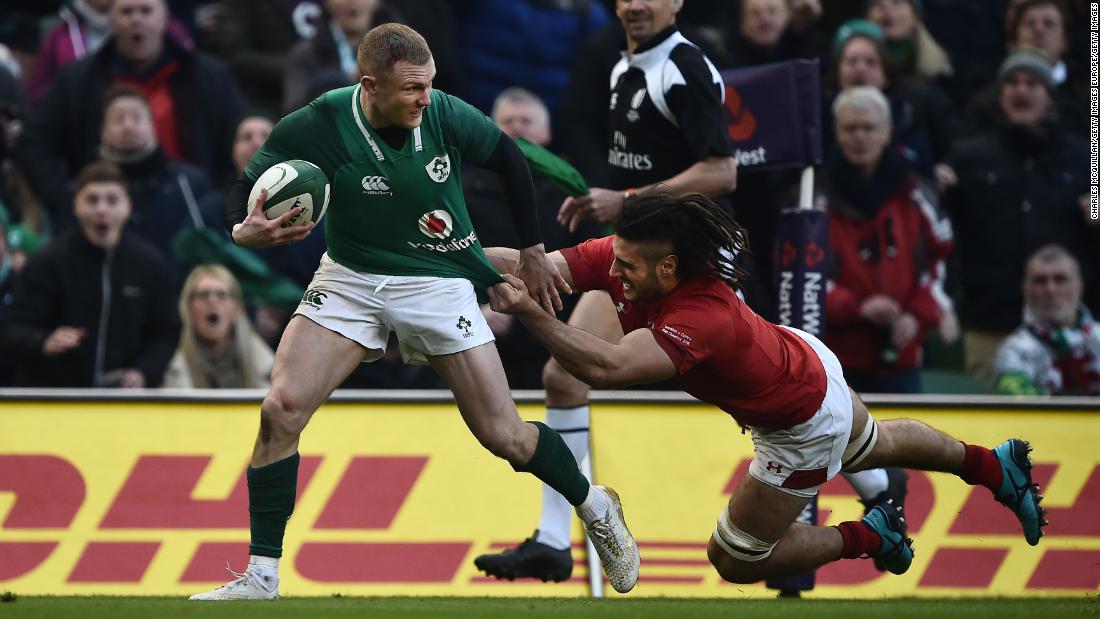 Keith Earls tries to escape the clutches of Welsh flanker Josh Navidi.