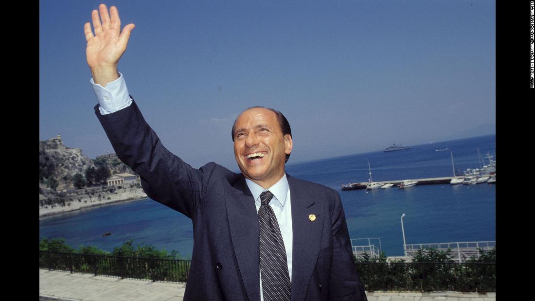 Berlusconi waves while attending a European Council meeting in Corfu, Greece, in June 1994.