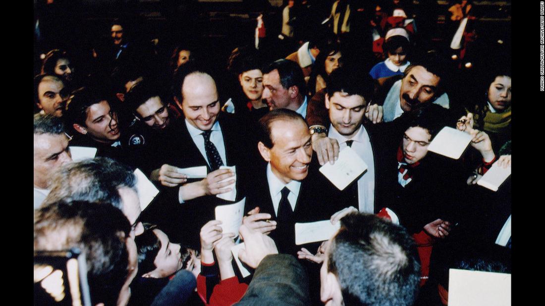 Berlusconi is surrounded by supporters during a rally in Rome in February 1994.