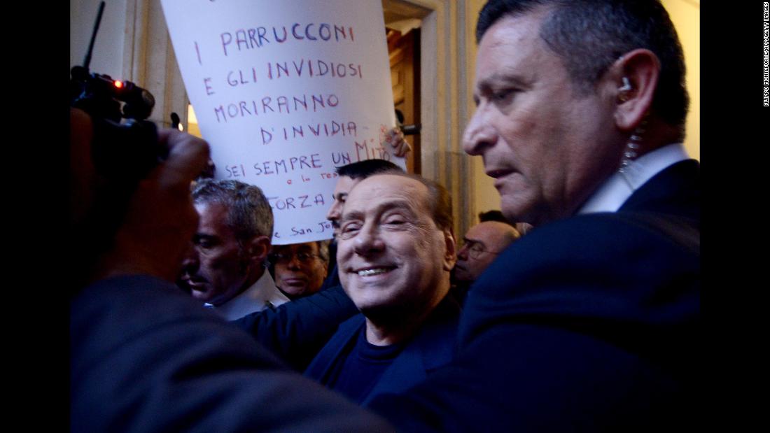 Berlusconi smiles as he arrives at his home in Rome in March 2015. Italy&#39;s top court had just cleared him of charges that he paid for sex with an underage dancer and then abused his position as prime minister to cover it up.