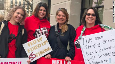 Lori Hausvater, left, with other teachers who came to the Capitol to give their views on issues.