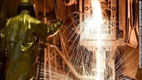 SALZGITTER, GERMANY - MARCH 01: An employee works in front of the blast furnace past rolls of sheet steel at a mill of German steel producer Salzgitter AG on March 1, 2018 in Salzgitter, Germany. Salzgitter, one of Europe's biggest steel makers, recorded better-than-expected profits in preliminary results for 2017. The company will hold its annual press conference on March 16. (Photo by Alexander Koerner/Getty Images)