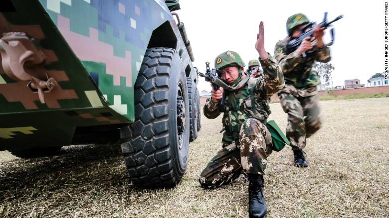 Chinese troops particpate in an anti-riot armored-vehicle training exercise on February 10, 2018, Yunnan province.