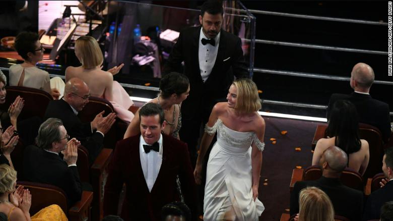 Comedian Jimmy Kimmel (C), Australian actress Margot Robbie (R), Israeli actress Gal Gadot (C,L) and actor Armie Hammer interact with movie goers at the Chinese theatre during the 90th Annual Academy Awards show on March 4, 2018 in Hollywood, California.