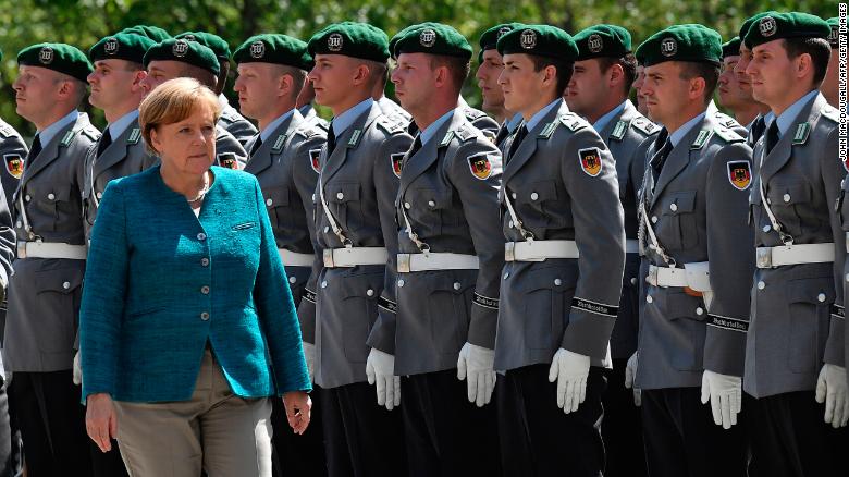 German Chancellor Angela Merkel greets the soldiers of the military honour guard ahead of the welcoming ceremony for Estonia&#39;s Prime Minister Jueri Ratas at the Chancellery in Berlin on June 15, 2017.