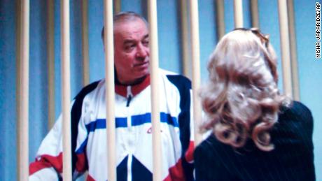 FILE - In this Wednesday, Aug. 9, 2006 file photo, Sergei Skripal speaks to his lawyer from behind bars seen on a screen of a monitor outside a courtroom in Moscow. It has been reported on Monday, March 5, 2018 by the British media that Skripal is in critical condition after exposure to &#39;unknown substance&#39; in English city of Salisbury. (AP Photo/Misha Japaridze, File)