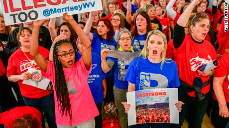 Teachers hold a rally Monday outside Senate chambers in the West Virginia state Capitol.