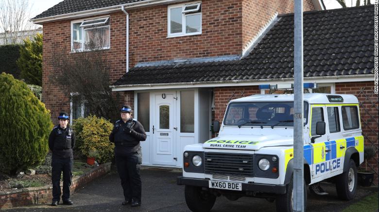 Police officers stand outside Sergei Skripal&#39;s home in Salisbury.
 