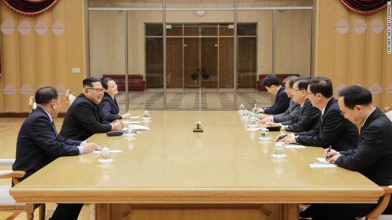 This picture released by North Korea&#39;s official Korean Central News Agency (KCNA) on March 6, 2018 shows North Korean leader Kim Jong Un (second left) meeting with the South Korean delegation. His sister Kim Yo Jong is seated next to him.