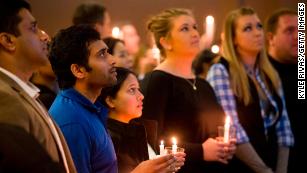 Shooting victim Alok Madasani, second from left, attends a prayer vigil in February 2017.