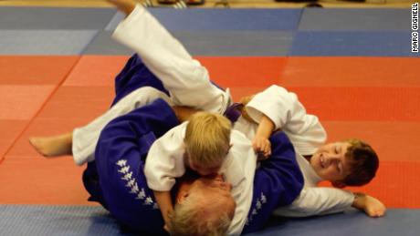Brian Jacks tries out judo with some kids at a workshop in Derby in the UK