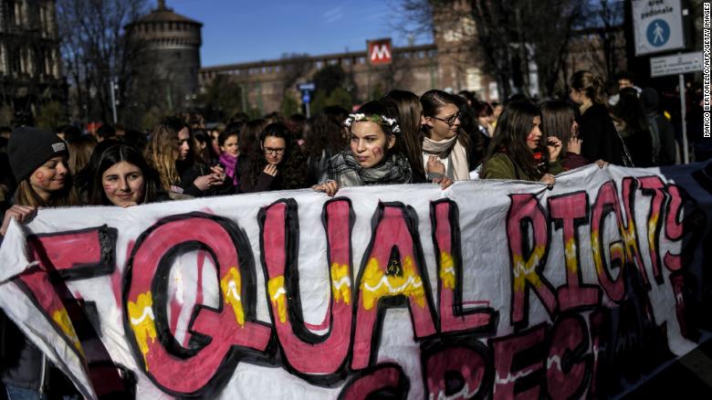 Young women take part in the Women&#39;s March Against Violence as part of International Women&#39;s Day, on March 8 in Milan, Italy.