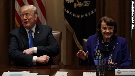 President Donald Trump and Democratic Sen. Dianne Feinstein of California share a moment during a meeting with bipartisan members of the Congress at the Cabinet Room of the White House on February 28, 2018 in Washington, DC. 