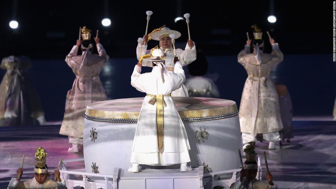 Drummers perform on the traditional Korean buk drums at the opening ceremony.