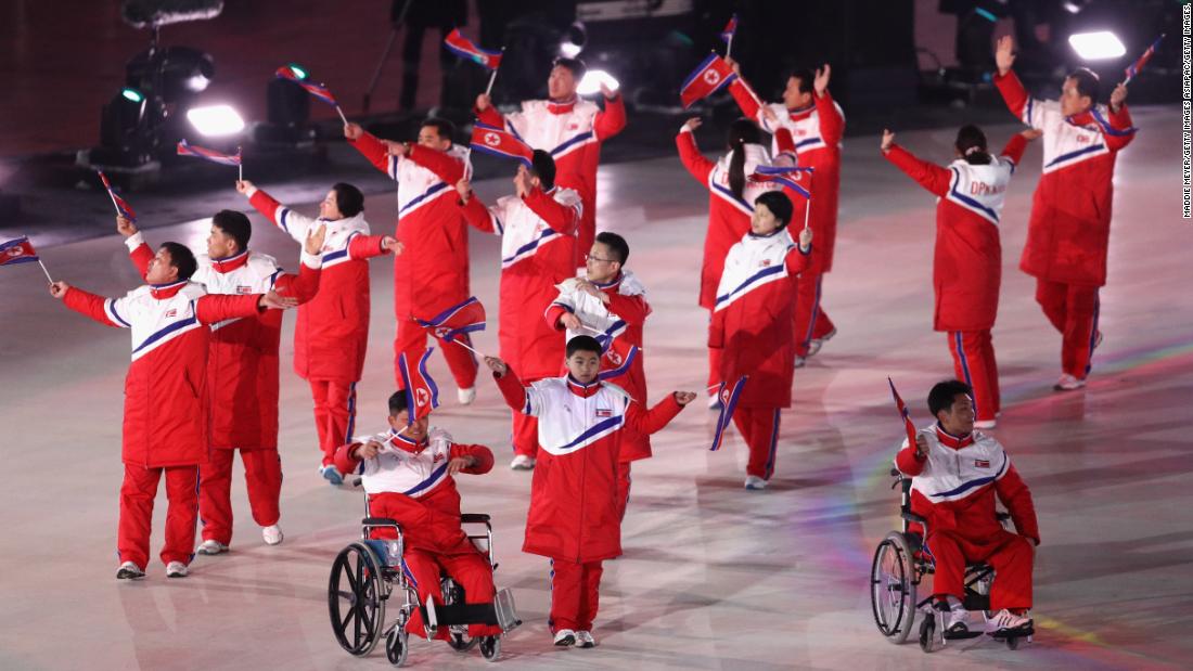 The North Korean delegation follow their two athletes into the arena during the Parade of Nations.