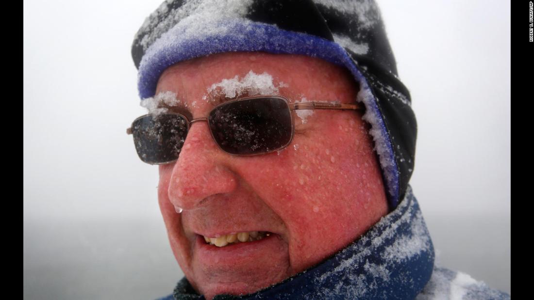 Snow accumulates on Paul Knight&#39;s eyebrows as he walks in Portland, Maine, on March 13. &quot;We&#39;re not out of winter yet, that&#39;s for sure,&quot; he said.