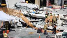 MIAMI, FL - MARCH 15:  Miami-Dade Fire Rescue Department personel and other rescue units work at the scene where a pedestrian bridge collapsed a few days after it was built over southwest 8th street allowing people to bypass the busy street to reach Florida International University on March 15, 2018 in Miami, Florida. Reports indicate that there are an unknown number of fatalities as a result of the collapse, which crushed at least five cars.  (Photo by Joe Raedle/Getty Images)