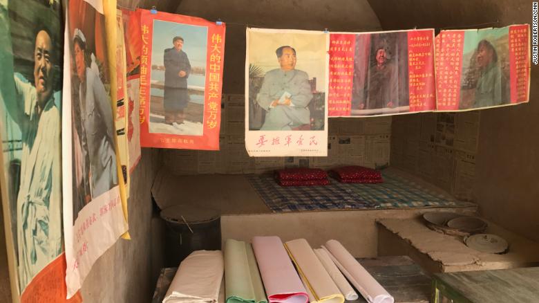 Posters of Mao Zedong and other reproduced Cultural Revolution-era articles are on display in several &quot;cave houses&quot; that Xi lived in the village.