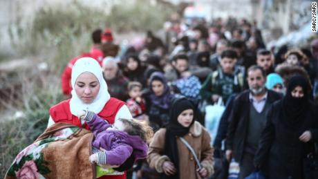 Airstrikes hit Syrian enclave where many are fleeing, activists say