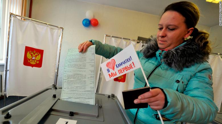 A woman prepares to cast her ballot at a polling station in Yelizovo, Russia. 