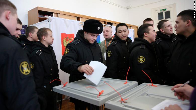Military sailors cast their ballots at a polling station in the Russian far eastern port city of Vladivostok.