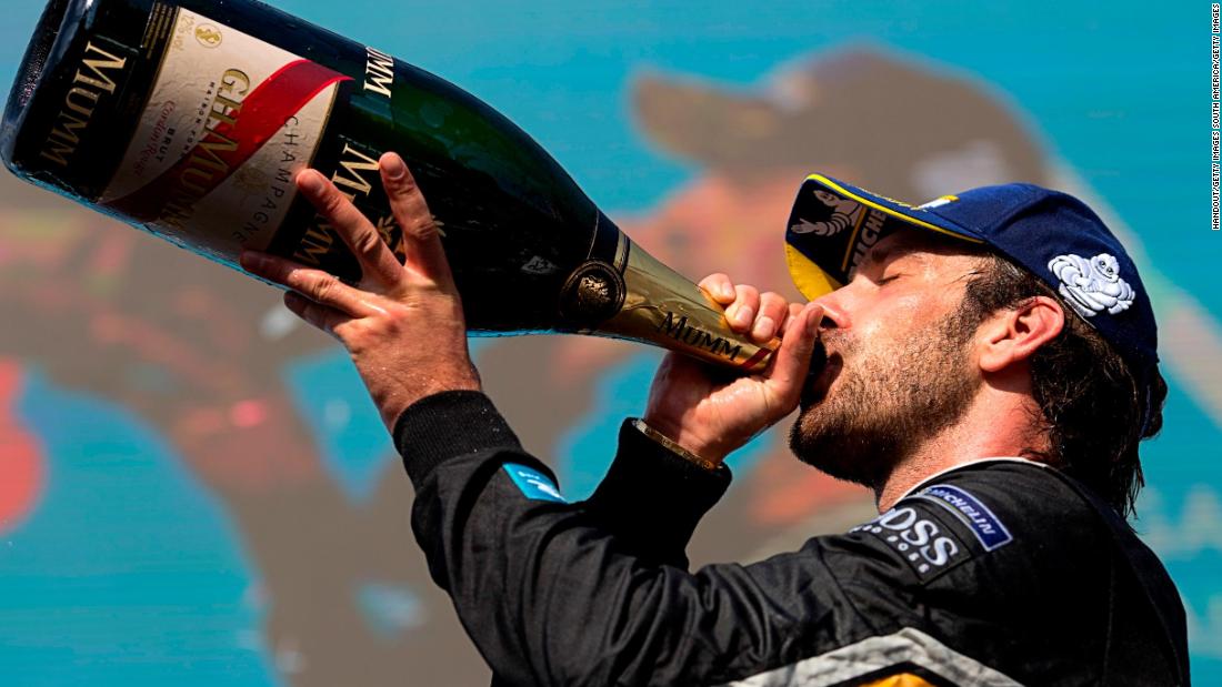 Vergne celebrated with a swig of champagne. 