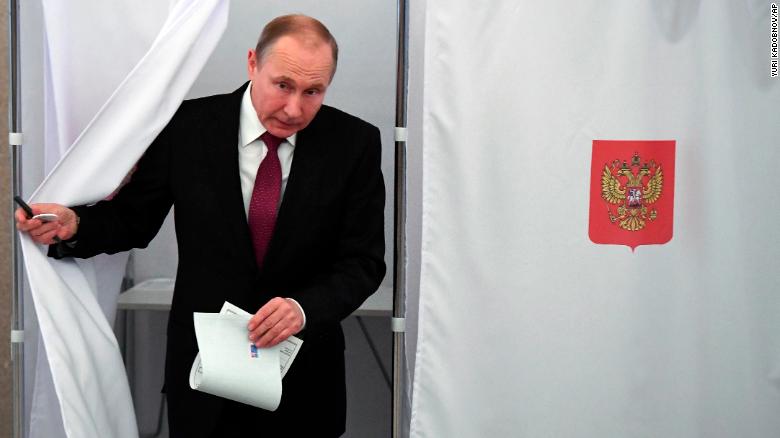 President Vladimir Putin casts his vote in Moscow on Sunday. 