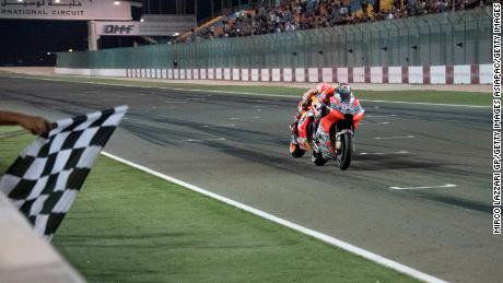 Marc Marquez chases Andreas Dovizioso on a nail-biting final lap in the MotoGP of Qatar.