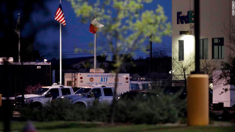 An ATF vehicle sits at a FedEx sorting center where a package exploded Tuesday in Schertz, Texas.