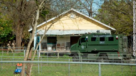 Authorities surround the home of the Austin bombing suspect Mark Conditt in Pflugerville, Texas, on Wednesday.