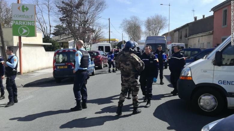 Police respond to the supermarket siege Friday in Trèbes.