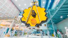 It&#39;s springtime and the deployed primary mirror of NASA&#39;s James Webb Space Telescope looks like a spring flower in full bloom.
 
In this photo, NASA technicians lifted the telescope using a crane and moved it inside a clean room at NASA&#39;s Goddard Space Flight Center in Greenbelt, Maryland. Once launched into space, the Webb telescope&#39;s 18-segmented gold mirror is specially designed to capture infrared light from the first galaxies that formed in the early Universe, and will help the telescope peer inside dust clouds where stars and planetary systems are forming today.
 
The James Webb Space Telescope is the scientific successor to NASA&#39;s Hubble Space Telescope. It will be the most powerful space telescope ever built. Webb is an international project led by NASA with its partners, ESA (European Space Agency) and the Canadian Space Agency.
