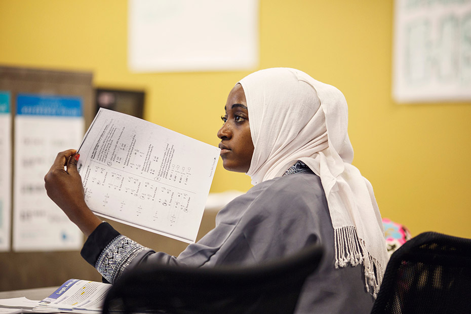 Batulo listens as her math teacher at Georgia Piedmont Technical College tells the class that building vocabulary will help them handle tricky GED test questions. (Melissa Golden/Redux for CNN)