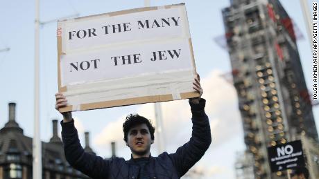 Members of the Jewish community protest against Corbyn and anti-Semitism outside Parliament in March.